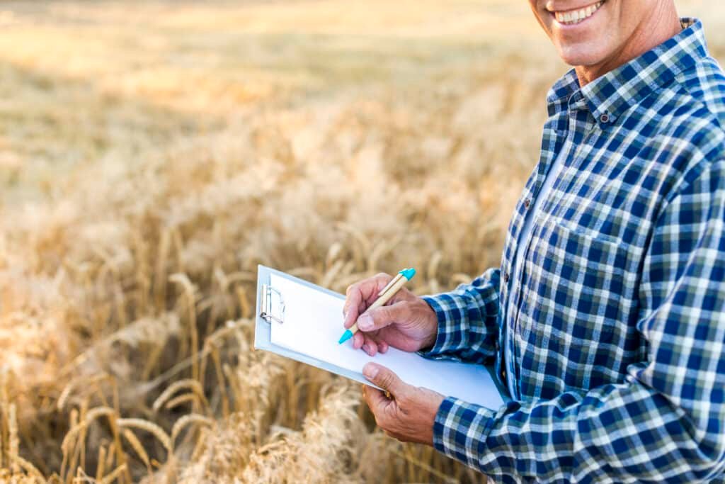 farmers in hand man writing clipboard