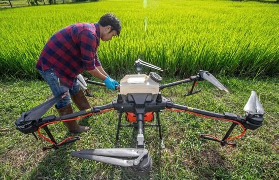 DJI agriculture drone spraying crops with precision farming technology
